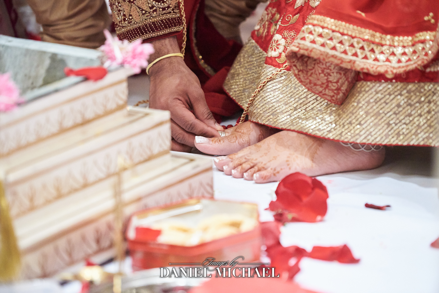 South Asian bride receiving Metti during her wedding ceremony